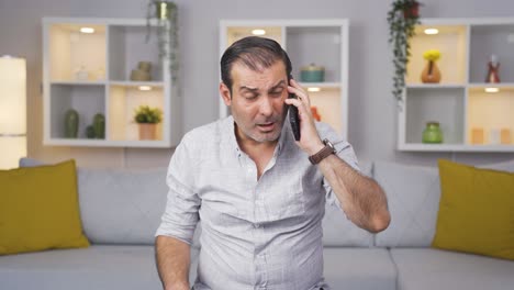 Man-getting-bad-news-on-the-phone-gets-upset.